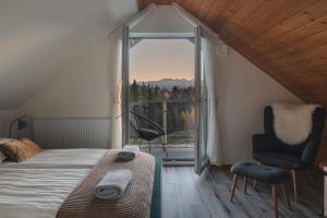 Postel nebo postele na pokoji v ubytování Domek nad zalewem