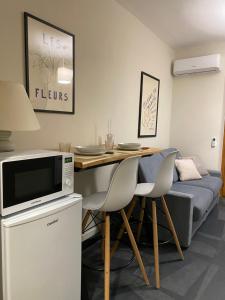 a living room with a table and a couch at Casa di Gea in Biella
