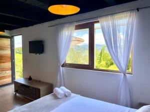 Ένα ή περισσότερα κρεβάτια σε δωμάτιο στο MINI-SUiTE CONFORT