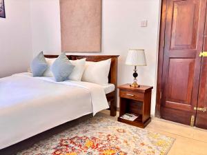 Ένα ή περισσότερα κρεβάτια σε δωμάτιο στο Nest Villas