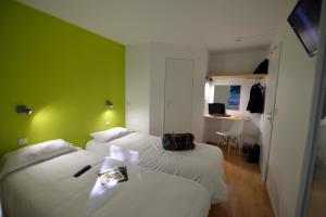 Postel nebo postele na pokoji v ubytování Fasthôtel Limoges Nord - FH Confort
