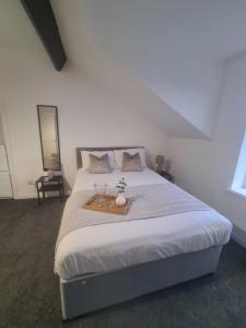 En eller flere senge i et værelse på Homestay Sunderland