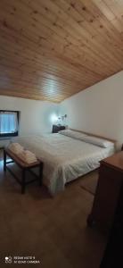 Ένα ή περισσότερα κρεβάτια σε δωμάτιο στο Mansarda Anna e Marco