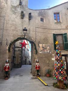a building with a christmas tree in front of it at NIDO SCANSANESE in Scansano