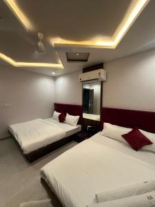 Postel nebo postele na pokoji v ubytování Hotel ELITE CHOICE