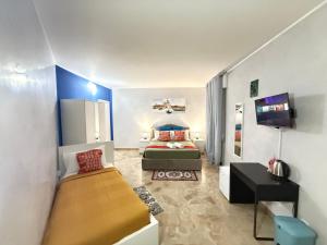 a bedroom with a bed and a tv in it at Casa Raffinata in Mestre