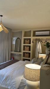 a bedroom with a bed and a table in it at نزل فاخر in Taif