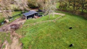 an aerial view of a barn in a field at The woolshed - Oruanui in Oruanui