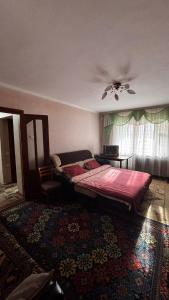 Giường trong phòng chung tại Hostel Apartament