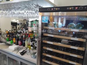 a display case filled with lots of wine bottles at The Station Hotel Insch in Insch