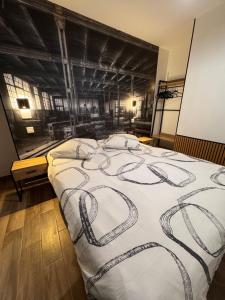 Ένα ή περισσότερα κρεβάτια σε δωμάτιο στο L'atelier