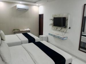 TV a/nebo společenská místnost v ubytování Hotel The Tulip