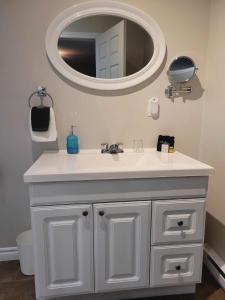 a bathroom with a white sink and a mirror at Bed and Breakfast Du Repos in Saint Quentin +19 photos