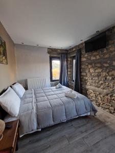 Postel nebo postele na pokoji v ubytování Vasiliki Pramanta villas