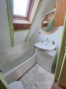 a bathroom with a sink and a toilet and a tub at Maison quercynoise Coeur du causse 4 à 8 pers in Durbans +10 photos