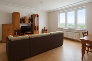 a living room with a couch and a television at MarinaMar Camariñas in Camariñas