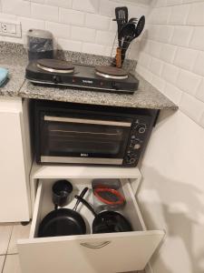 Kuchyň nebo kuchyňský kout v ubytování Luminoso y cálido atardecer