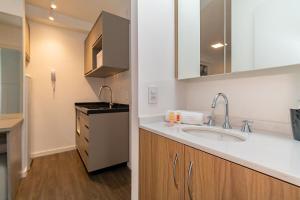 Η κουζίνα ή μικρή κουζίνα στο Apartamento Safari de 1 Quarto com Vaga - PRI1401 +26 φωτογραφίες