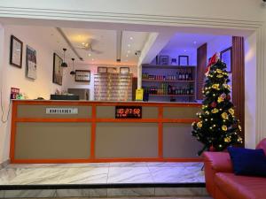 a christmas tree in the front of a store at Bonsukoda Lodge in Accra