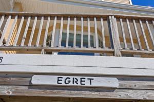 a wooden deck with a sign that reads enter at CAC-6B - Egret in Buxton
