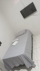 a white room with a tent on the ceiling at Pousada Cajueiro in Juazeiro do Norte