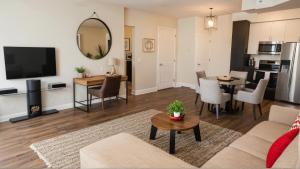 a living room with a couch and a table at Stylish Urban Escape in Downtown Los Angeles in Los Angeles