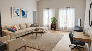 a living room with a couch and a table at Stylish Urban Escape in Downtown Los Angeles in Los Angeles