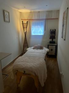 a bedroom with a bed in a room with a window at Casa del bienestar in Bermeo