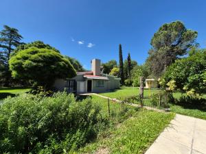 a house in the middle of a yard at Oasis in Villa Anizacate