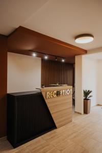 an office lobby with a reception counter with a reception desk at Gallus Inn in Aleksinac