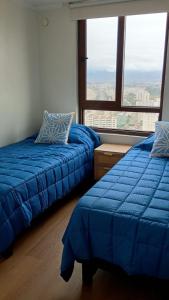 En eller flere senge i et værelse på Jardín del Mar Spa & Resort Apartment