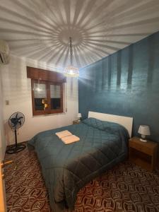 Ένα ή περισσότερα κρεβάτια σε δωμάτιο στο Al-Mar