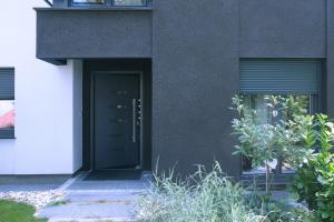 a black door on the side of a building at Apartman Gala in Čakovec