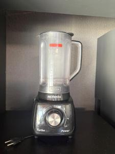 a blender sitting on top of a table at Espaço Atlântico in Goiânia