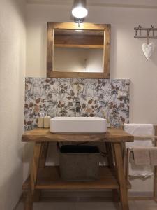 a bathroom with a sink and a mirror at Naš duam in Stregna
