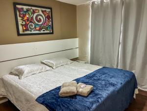 Ένα ή περισσότερα κρεβάτια σε δωμάτιο στο Flat no Centro de Campo Grande +40 φωτογραφίες