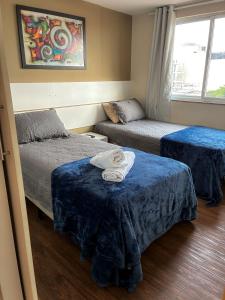 Ένα ή περισσότερα κρεβάτια σε δωμάτιο στο Flat no Centro de Campo Grande