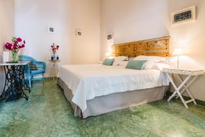 Un ou plusieurs lits dans un hébergement de l'établissement Hotel Boutique Casa de Colón