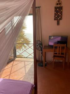 Телевизор и/или развлекательный центр в villa Atlantique