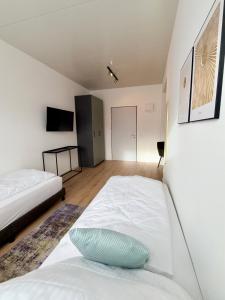 Postel nebo postele na pokoji v ubytování Business & fitter Apartment Schwabach + 9 fotografií