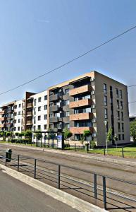 a large apartment building on the side of a road at VerdeViu Apartments 1 Prima Residence Universitatii in Oradea