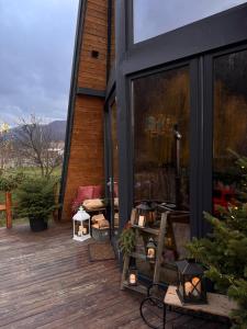a screened porch with a christmas tree on a house at A-Wine Villas in Novaci