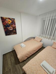 Ένα ή περισσότερα κρεβάτια σε δωμάτιο στο Apartman IVA