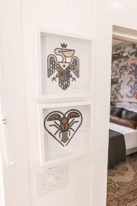 Una habitación con una puerta con dos calcomanías. en Downtown Lafayette Gem-1BR House with Free Parking, en Lafayette