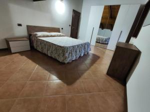 Postel nebo postele na pokoji v ubytování Locazione Turistica