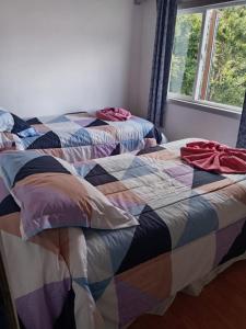 Ένα ή περισσότερα κρεβάτια σε δωμάτιο στο Cabañas ElyB