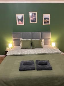 Ένα ή περισσότερα κρεβάτια σε δωμάτιο στο Apartament Hey Gron