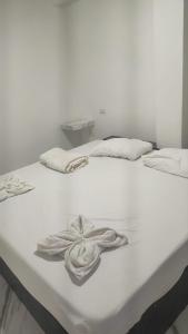 Ένα ή περισσότερα κρεβάτια σε δωμάτιο στο Hostal Manantiales La Esperanza