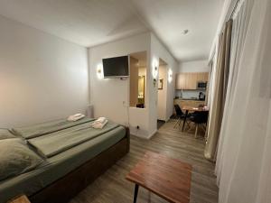 a hotel room with a bed and a kitchen at bookVienna "Paula" Apartments in Vienna