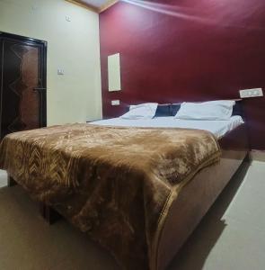 Postel nebo postele na pokoji v ubytování Gajanan Guest House